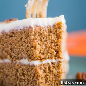 The ultimate Easy Carrot Cake with cream cheese frosting, a perfect dessert for sharing.