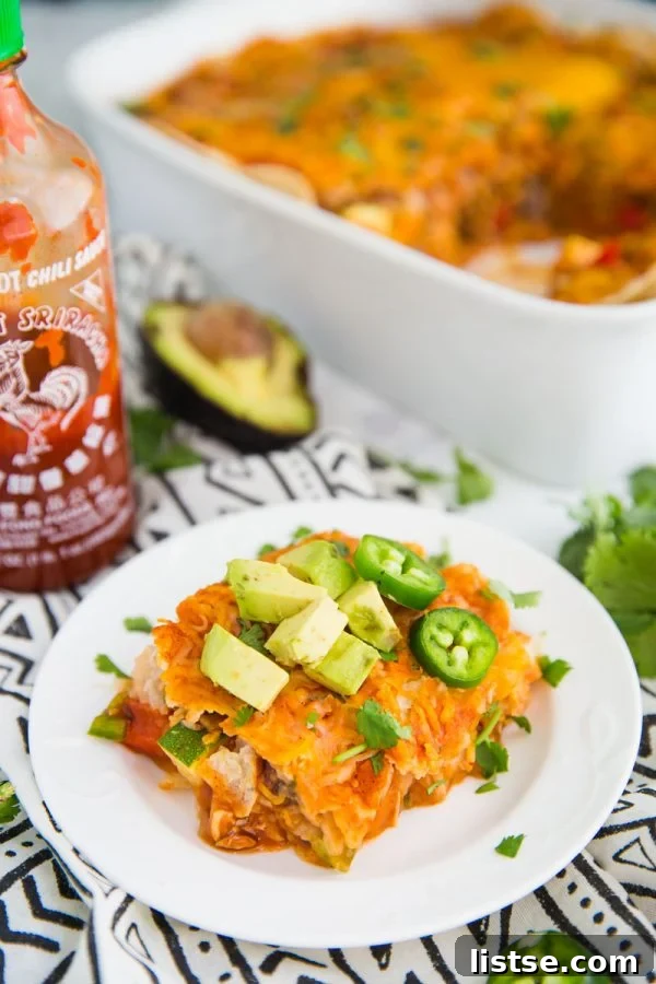 This Loaded Veggie Enchilada Casserole Recipe is a delicious take on traditional enchiladas. An easy dinner that is vegetarian and can even be made into a vegan enchilada casserole if you just leave off the cheese!