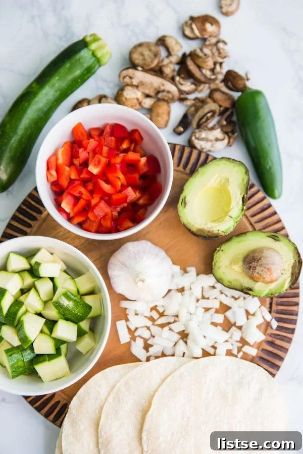 This Loaded Veggie Enchilada Casserole Recipe is a delicious take on traditional enchiladas. An easy dinner that is vegetarian and can even be made into a vegan enchilada casserole if you just leave off the cheese!
