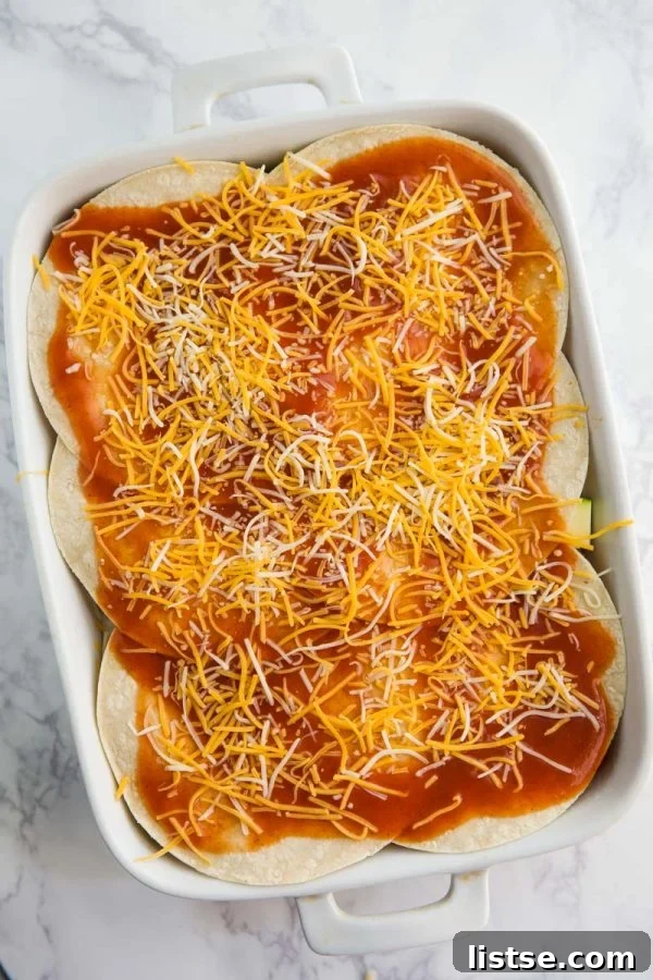 This Loaded Veggie Enchilada Casserole Recipe is a delicious take on traditional enchiladas. An easy dinner that is vegetarian and can even be made into a vegan enchilada casserole if you just leave off the cheese!