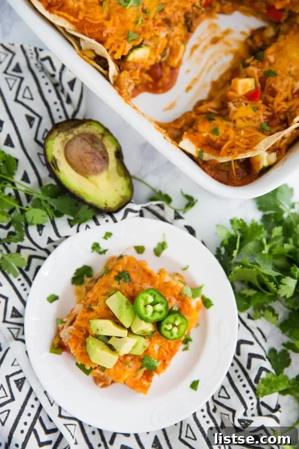 This Loaded Veggie Enchilada Casserole Recipe is a delicious take on traditional enchiladas. An easy dinner that is vegetarian and can even be made into a vegan enchilada casserole if you just leave off the cheese!
