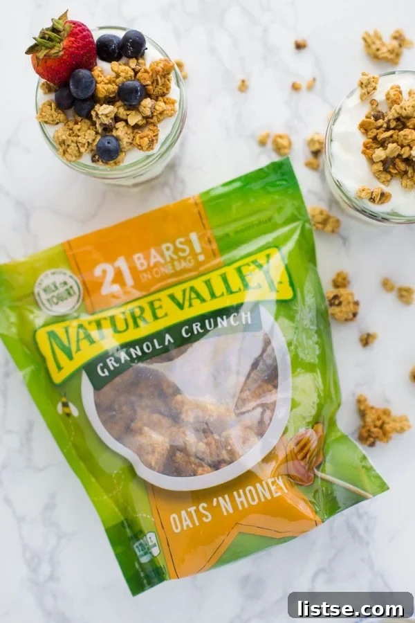 Smooth Moves Yogurt Parfait 3 Layered On-the-Go Yogurt Parfait with Nature Valley Oats 'n Honey granola, creamy yogurt, and fresh berries, ready for a healthy grab-and-go meal.