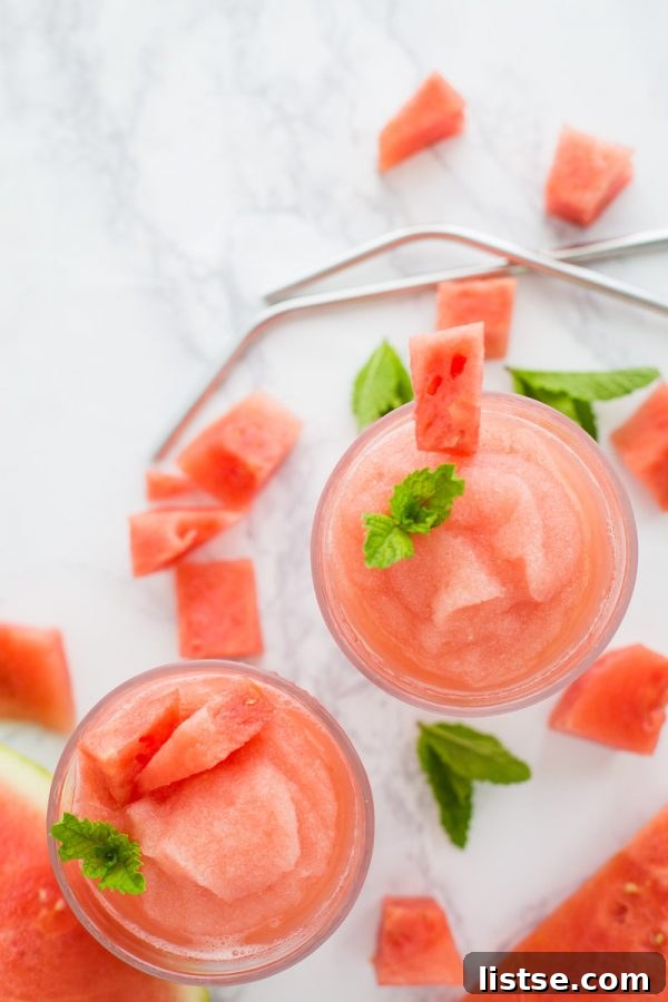 Refreshing Watermelon White Wine Slushies garnished with mint and watermelon slices