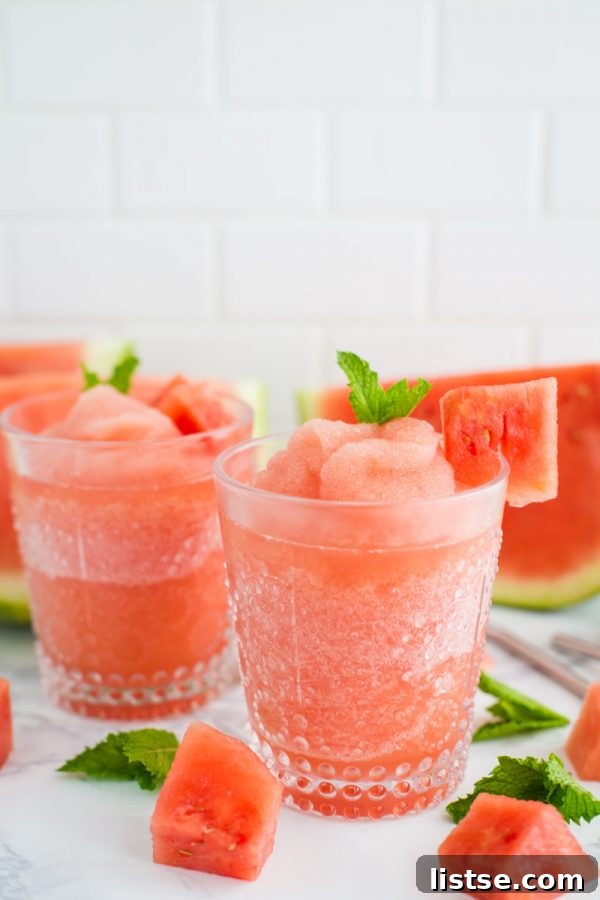 Close-up of Watermelon White Wine Slushies with mint garnish
