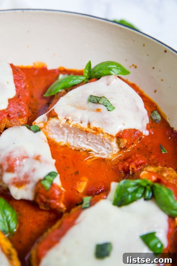 Golden brown Keto Chicken Parmesan baked with marinara and melted mozzarella, ready to serve.