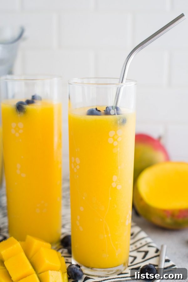 Tropical Mango Wine Slushie - a super easy and refreshing frozen cocktail for summer gatherings.
