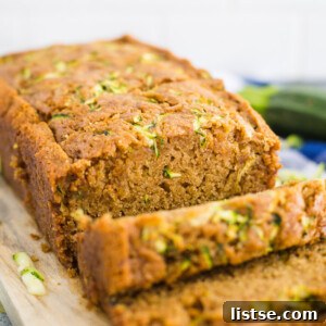 Moist Vegan Zucchini Loaf 8 A freshly baked loaf of Vegan Zucchini Bread, perfectly golden brown.
