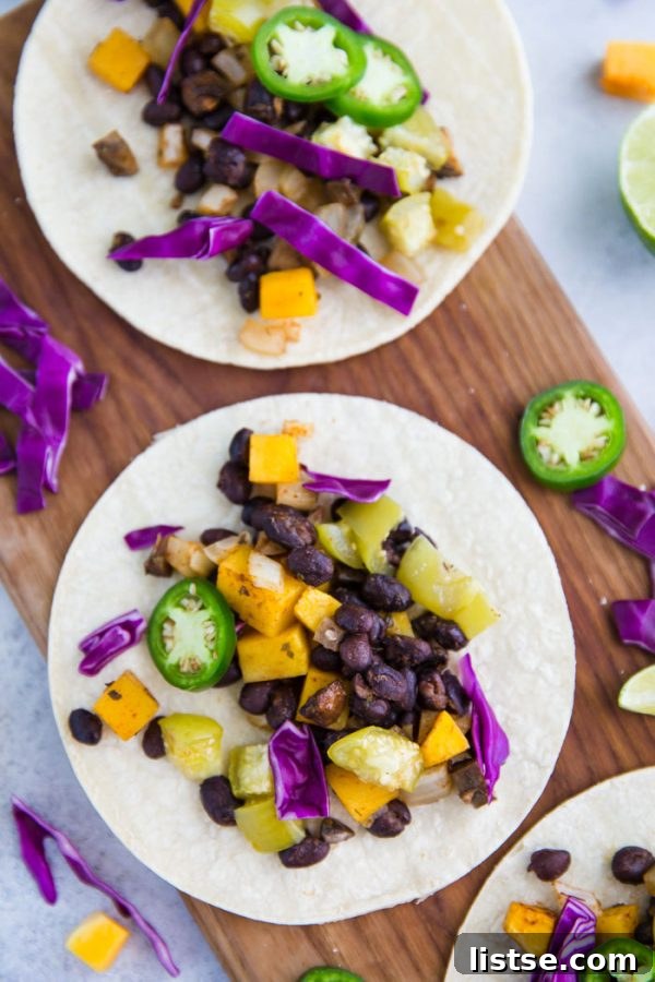 Final plating of Sheet Pan Squash Tacos with lime wedges, showcasing a perfect vegan dinner.
