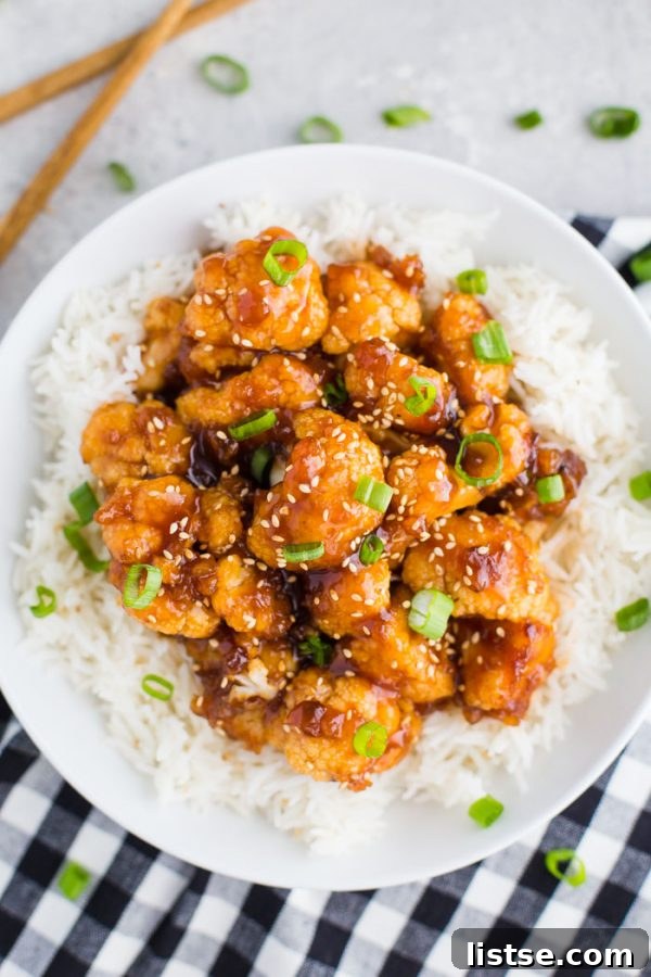Crispy Sweet and Sour Cauliflower, a delicious vegan alternative to classic takeout, served with rice for a satisfying weeknight meal.