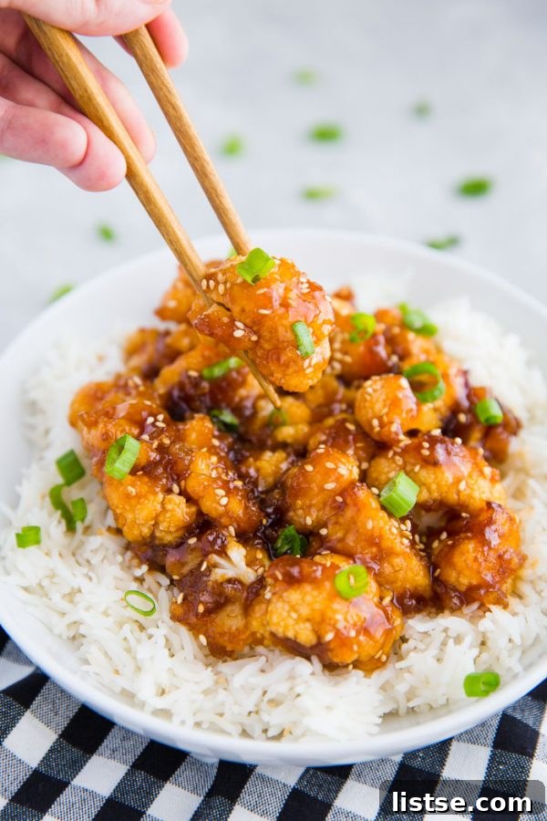 Close-up of freshly prepared Sweet and Sour Cauliflower, showcasing its tempting glaze and vibrant colors, perfect for a vegan meal.