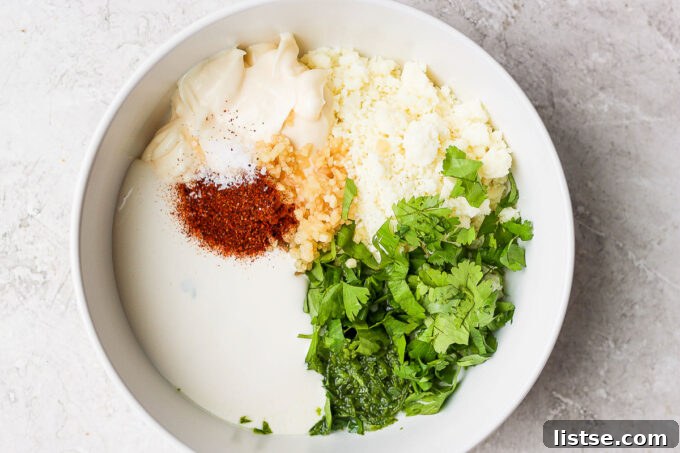 Ingredients for Mexican street corn sauce mixed in a bowl.