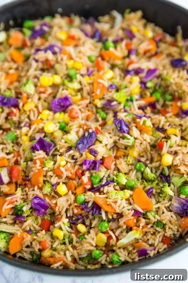 A close-up shot of the vibrant and delicious Loaded Veggie Fried Rice, ready to be served.