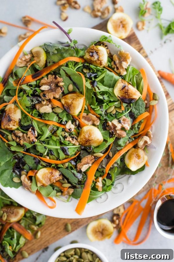 Rustic Fig and Walnut Salad 4 A whole Sweet Earth pizza, partially topped with the Fig and Walnut Arugula Salad, showcasing the delicious combination.