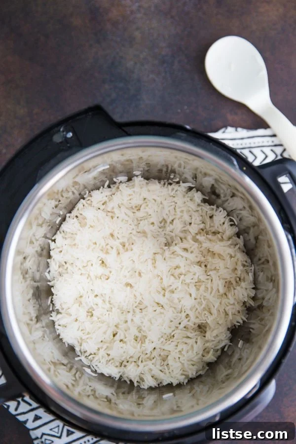 Fluffy Instant Pot Basmati Rice 5 Instant Pot inner pot filled with raw Basmati rice and water, prior to closing the lid