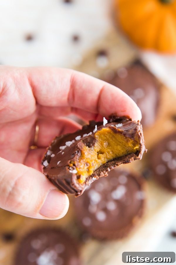 Finished Pumpkin Peanut Butter Cups stacked on a plate ready to eat