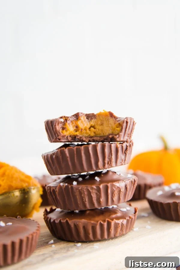 Close-up of a bitten Pumpkin Peanut Butter Cup revealing delicious layers