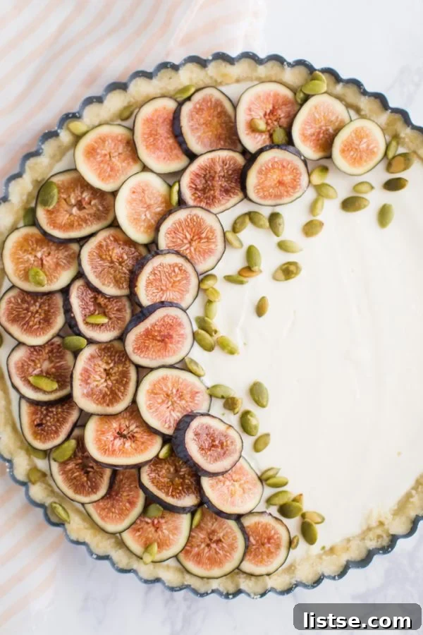 No Bake Fig Pie - sliced figs arranged beautifully on top of a creamy no-bake tart, ready for serving.