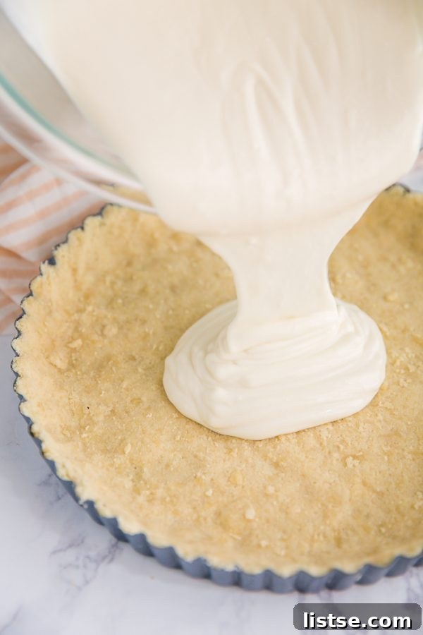 No Bake Fig Pie - creamy filling being poured into the gluten-free crust, ready for chilling.