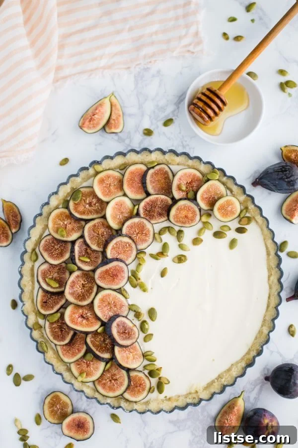 No Bake Fig Pie - close-up of the finished pie, garnished with fresh fig slices and pumpkin seeds.