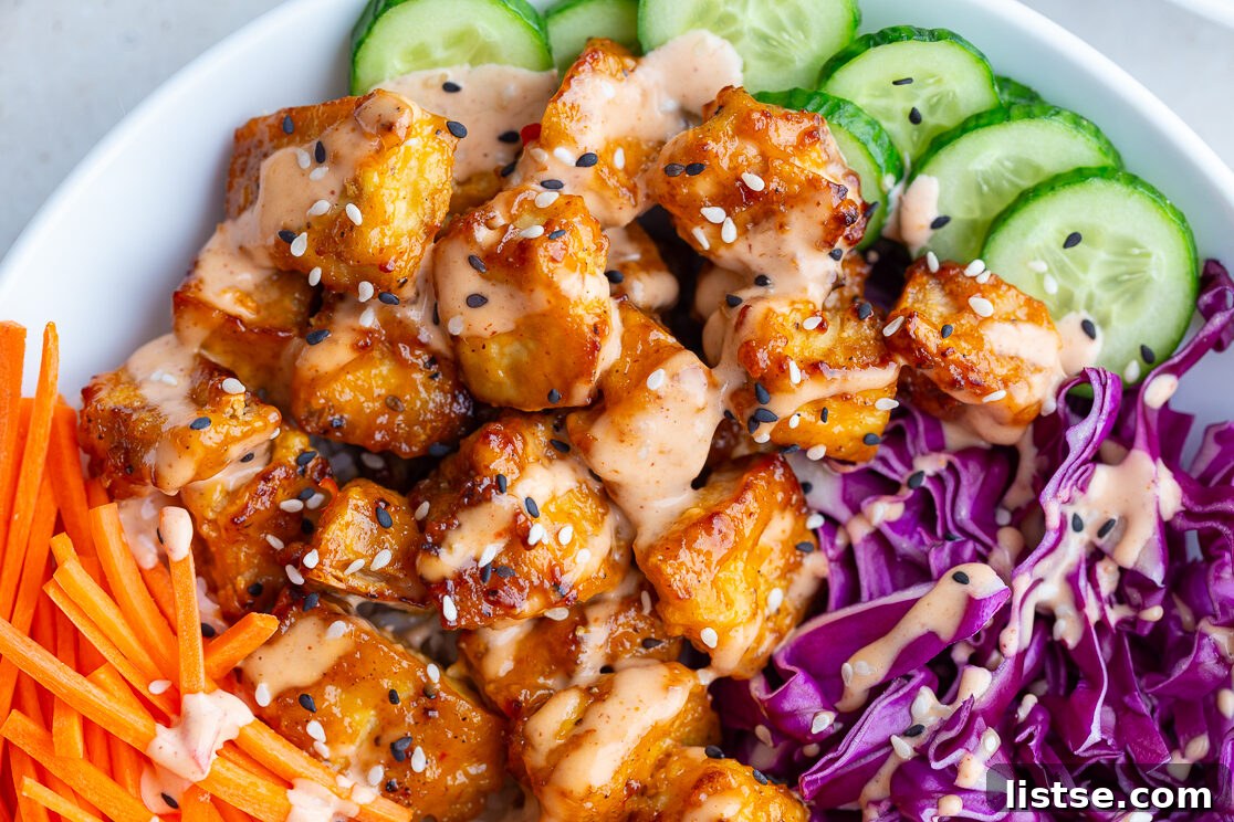 Crispy Bang Bang Tofu: Air Fry or Pan Fry 2 bang bang tofu bowls with rice, cucumber, red cabbage, and carrot sticks