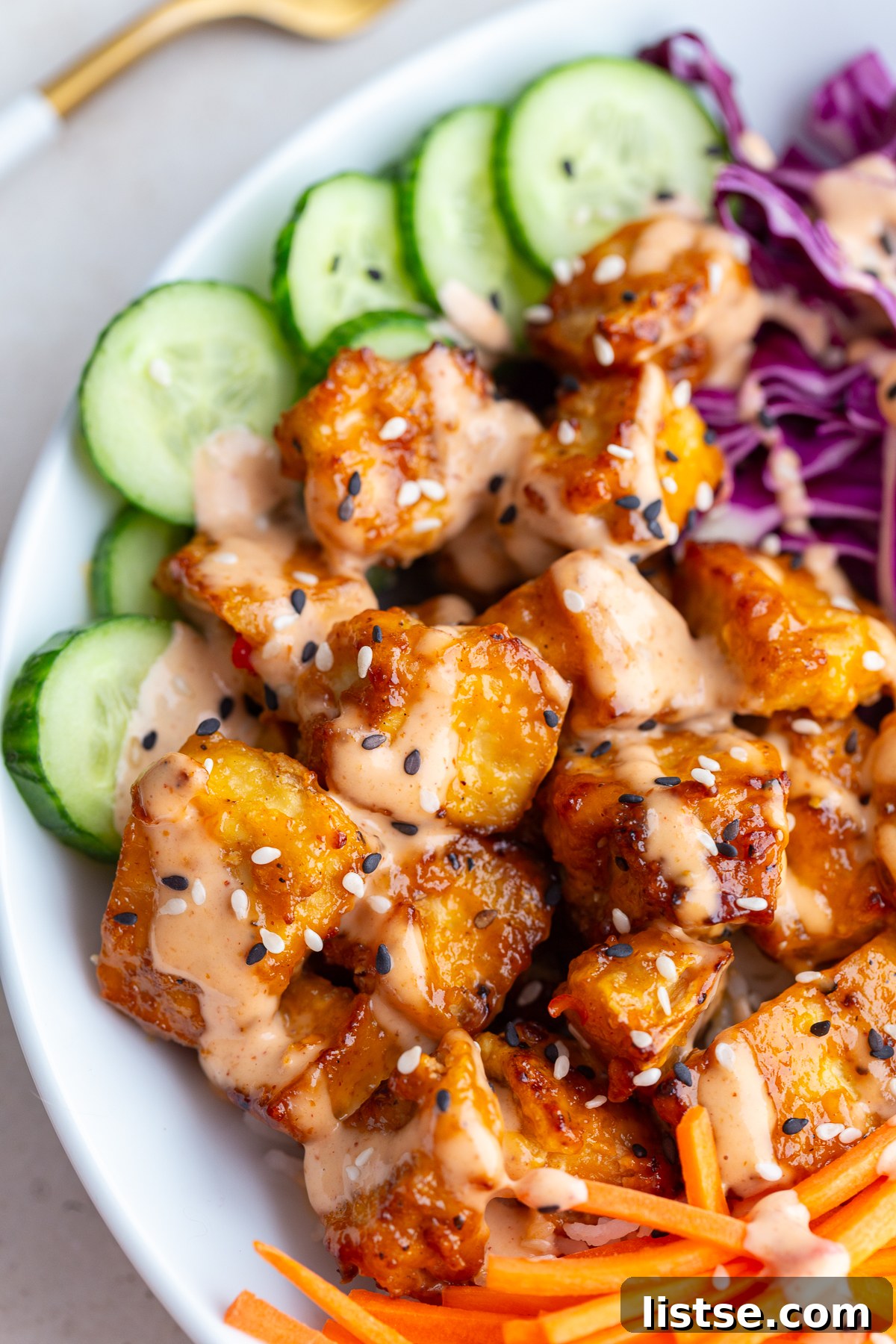 Crispy Bang Bang Tofu: Air Fry or Pan Fry 8 bang bang tofu bowls with rice, cucumber, red cabbage, and carrot sticks
