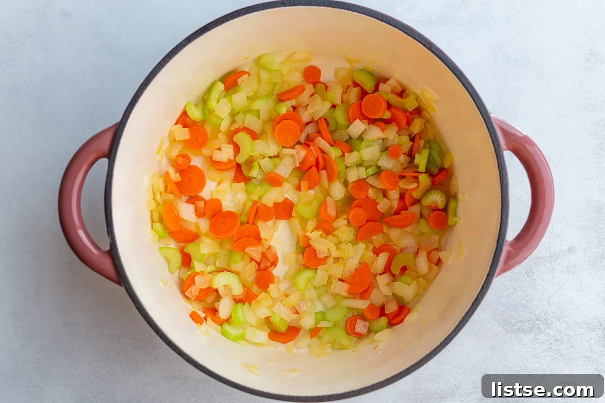 Quick and Cozy Vegan "Chicken" Noodle Soup 7 Diced celery, onion, and carrots sautéing in olive oil in a large pot.