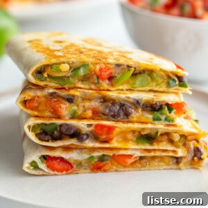 Effortless Meatless Quesadillas 9 Stack of vegetarian quesadillas with bell pepper, onion, cheese, and black beans