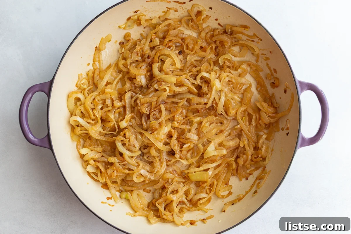 Caramelized onions in a large pot, deeply golden brown