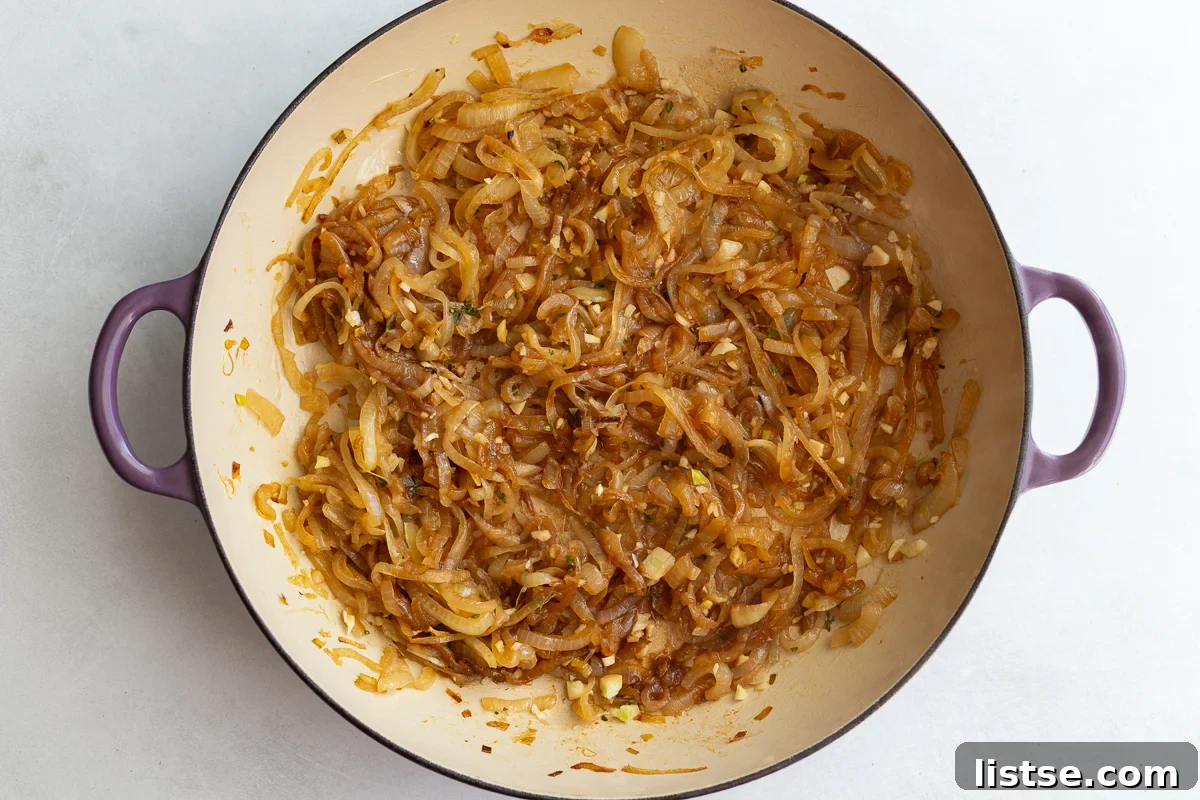 Caramelized onions and minced garlic with thyme in a large pot
