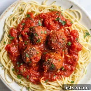Weekly Culinary Guide 42 7 A pan of easy vegan meatballs simmering in a rich marinara sauce.