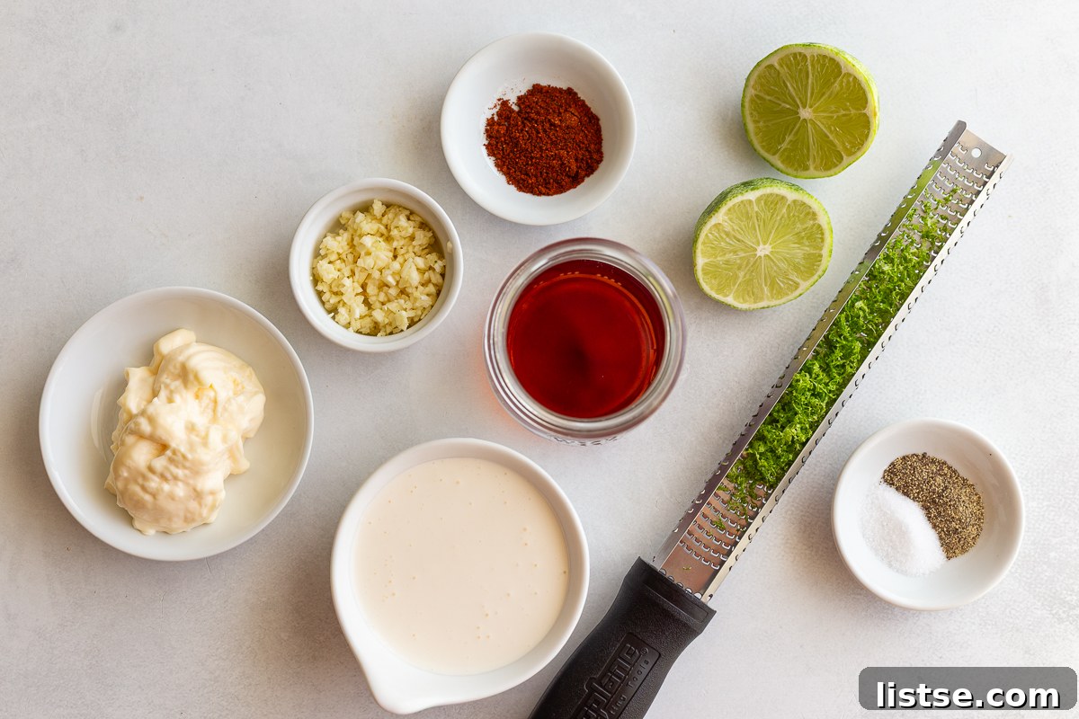 Ingredients for the creamy elote dressing, including mayonnaise, sour cream, lime juice, and spices, ready to be mixed.