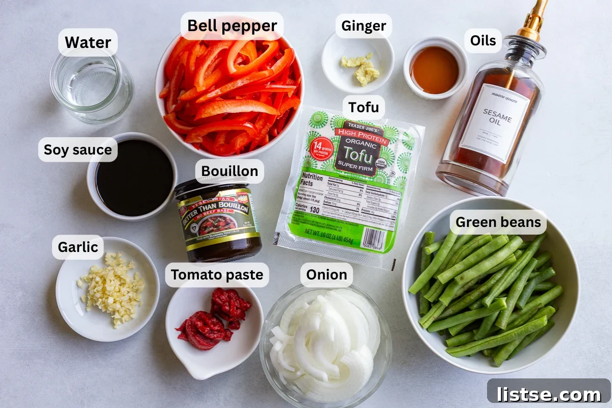 ingredients needed to make a ground tofu stir fry including tofu, bell pepper, green beans, oil, garlic, ginger, etc