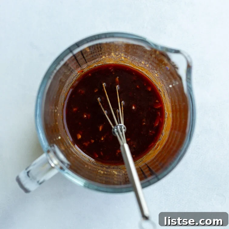 stir fry sauce whisked in a measuring cup