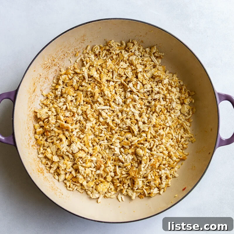 ground tofu in a large skillet