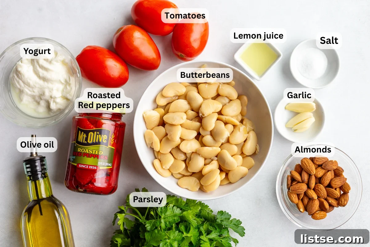 ingredients needed to make romesco butterbeans including butterbeans, roasted red peppers, tomatoes, almonds, salt, herbs, olive oil, etc