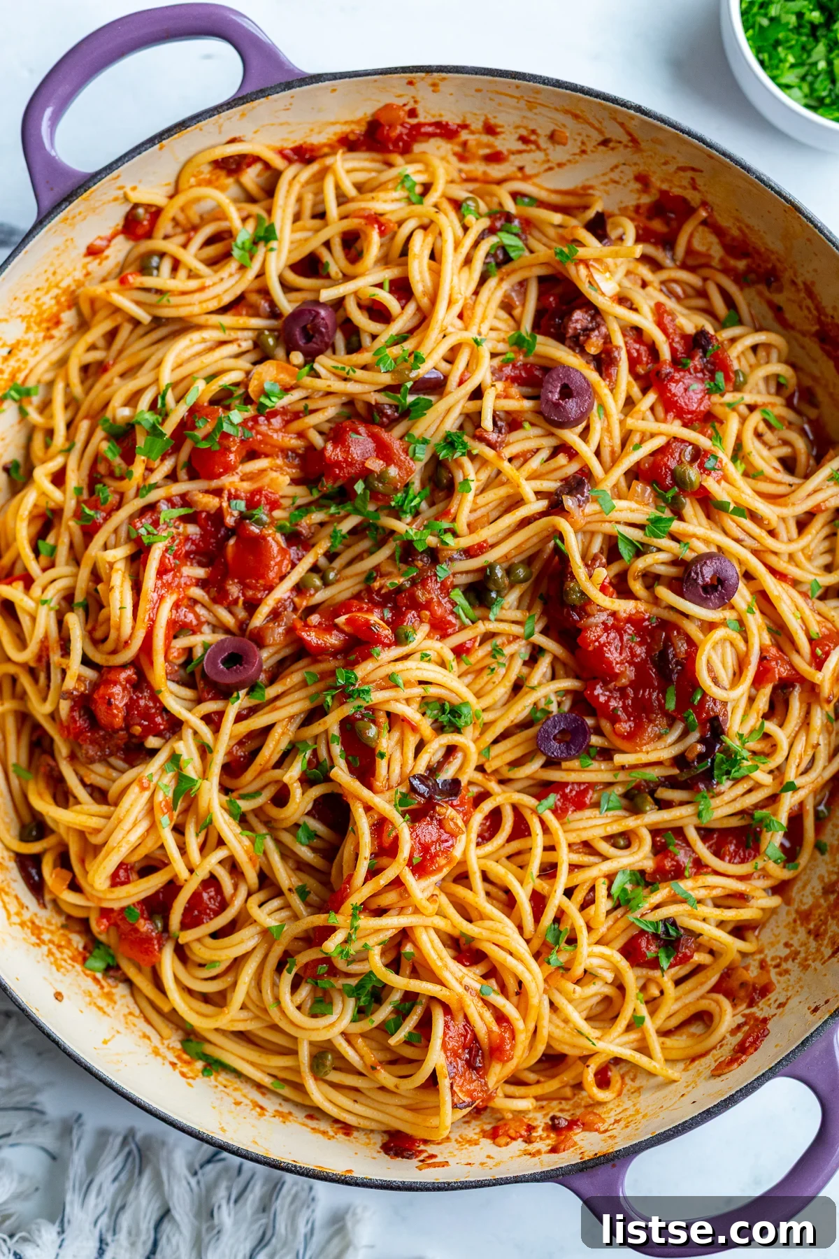 Classic Pasta Puttanesca Recipe with Anchovies and Olives 10 pasta alla puttanesca in a large skillet
