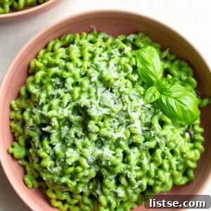 Green goddess pasta served in a pink bowl.