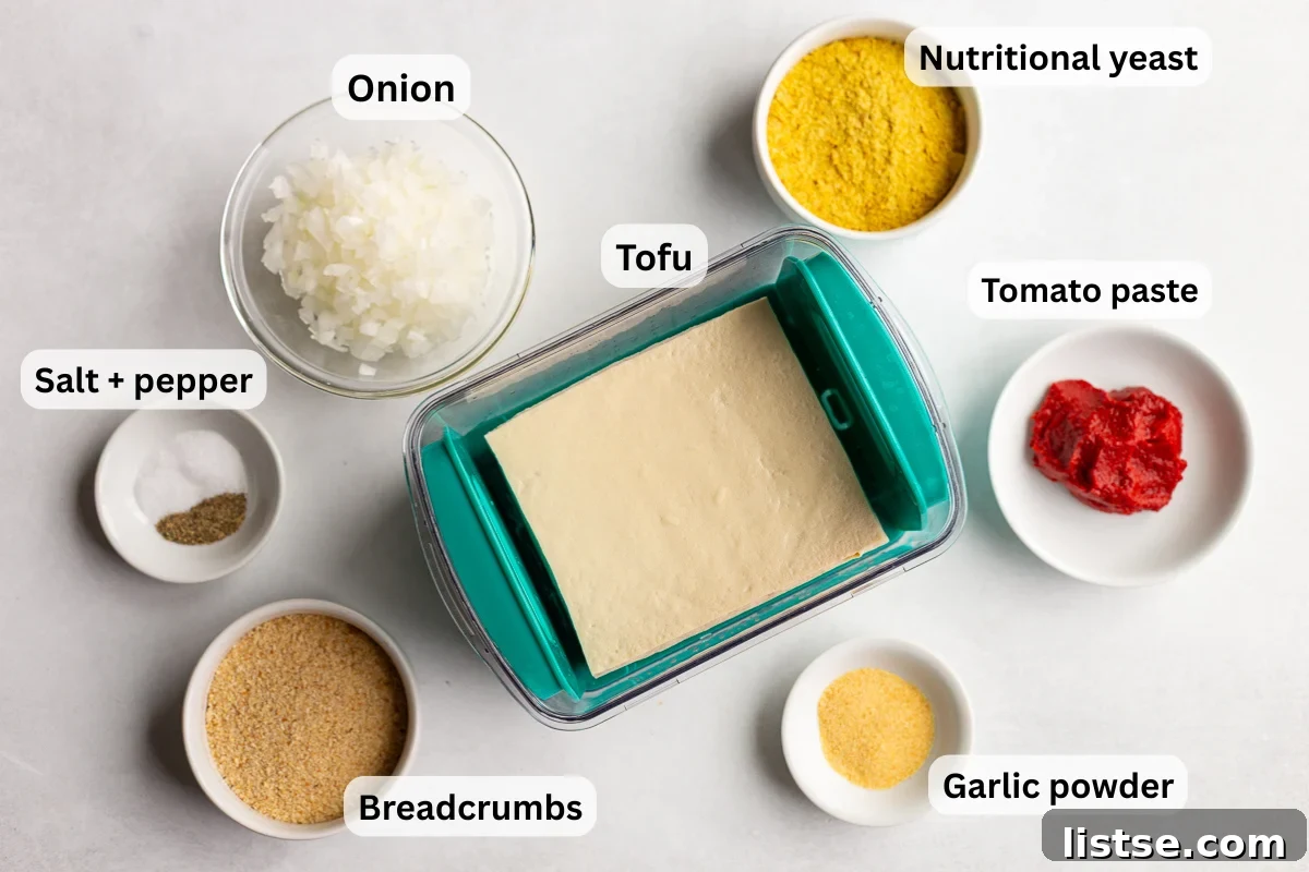 Crispy Vegan Tofu Meatballs: High-Protein Recipe 4 Labeled ingredients for tofu meatballs, including tofu, onion, breadcrumbs, nutritional yeast, tomato paste, and garlic powder.