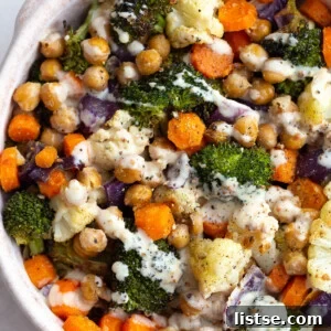 maple dijon roasted veggie bowls topped with dijon dressing