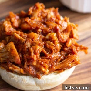 bbq jackfruit on the bottom half of a bun
