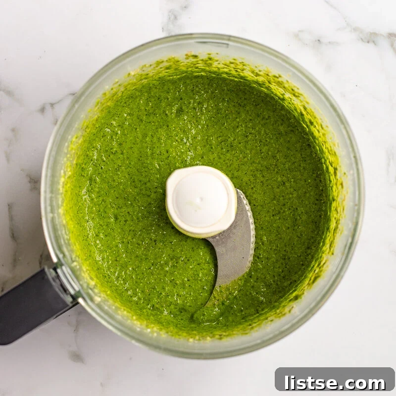 Homemade Walnut Pesto Recipe 8 Blended walnut pesto in the food processor bowl before the olive oil is drizzled in