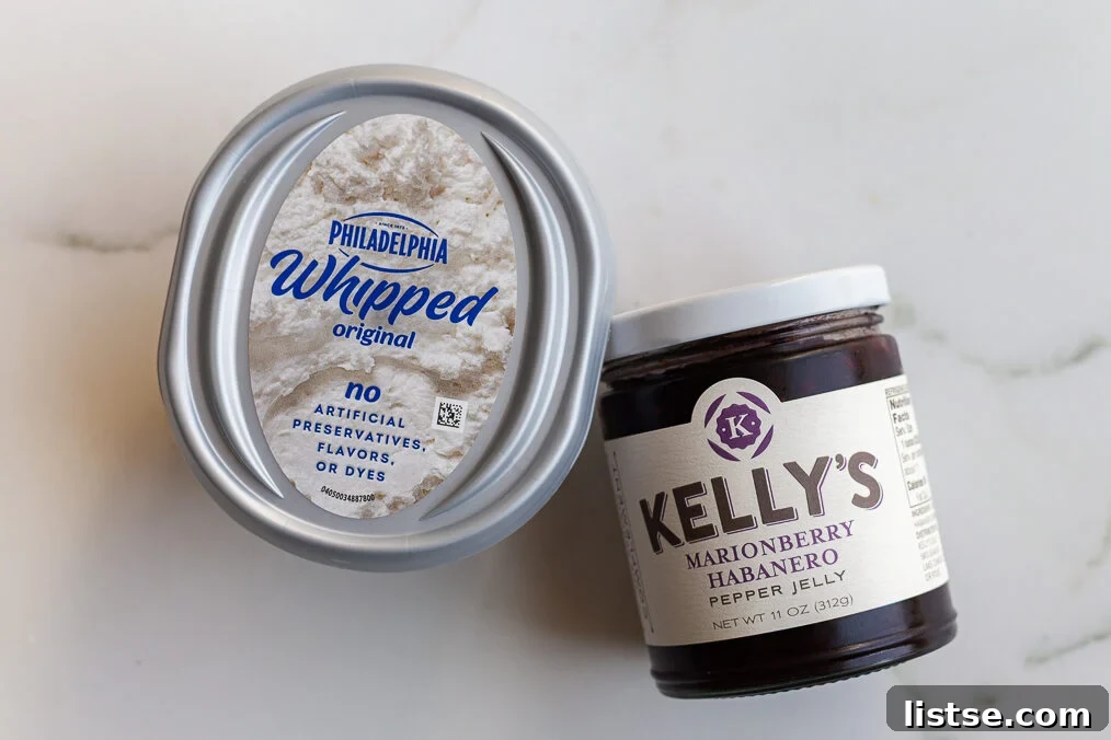 Two-Ingredient Pepper Jelly Cream Cheese Dip 4 ingredients needed for pepper jelly cream cheese dip including whipped cream cheese and kellys pepper jelly jam