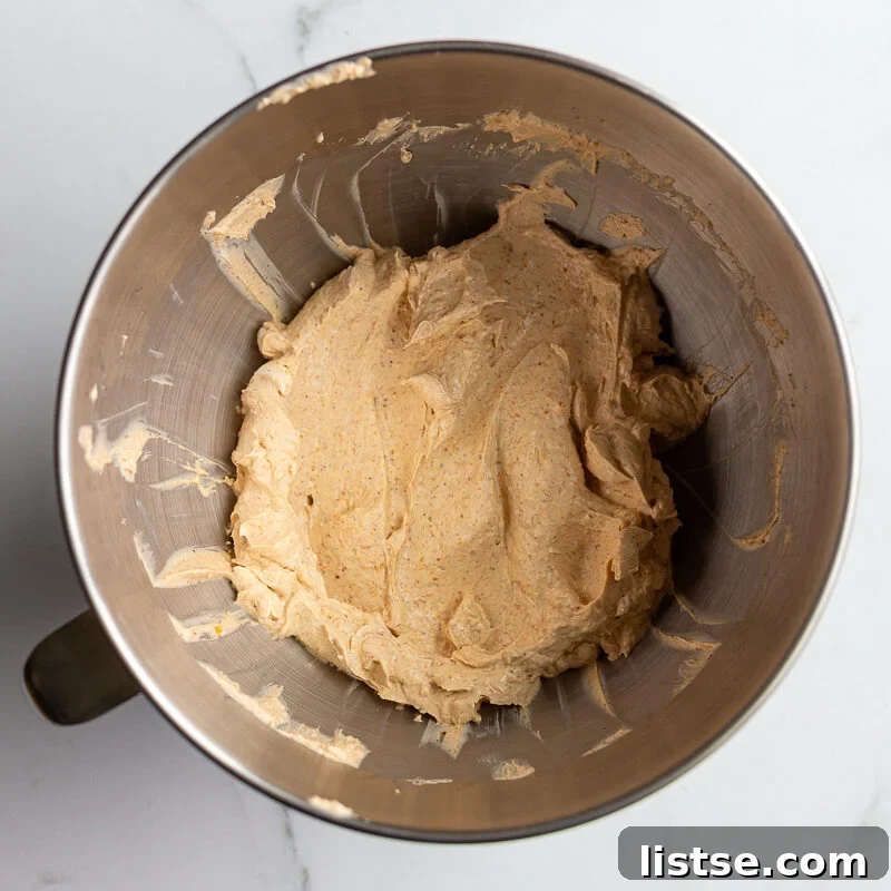 Cream Cheese Taco Dip Recipe for Parties 6 cream cheese and taco seasoning creamed together in a stand mixer bowl